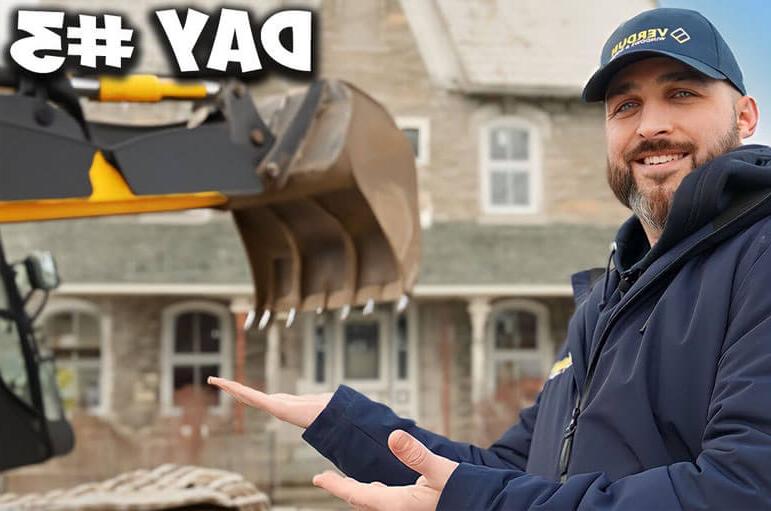 A Verdun sales rep poses in front of a classic, vintage home in Crysler, ON.